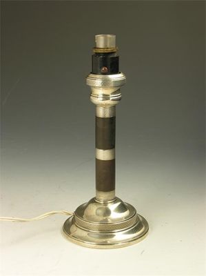 Appraisal: A Bakelite and silver mounted table lamp with engine turning