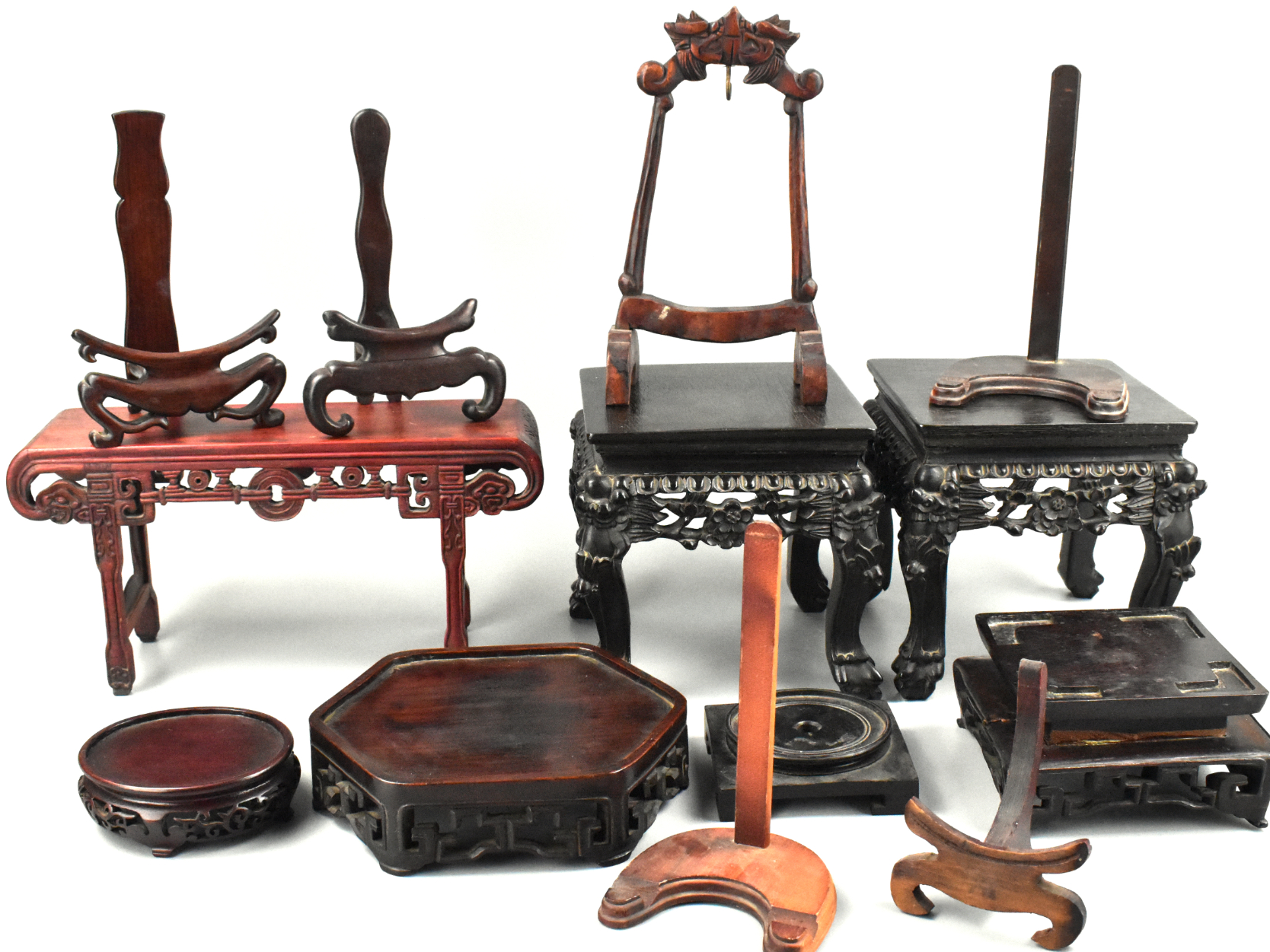 Appraisal: A group of Chinese wood stands includes different style of