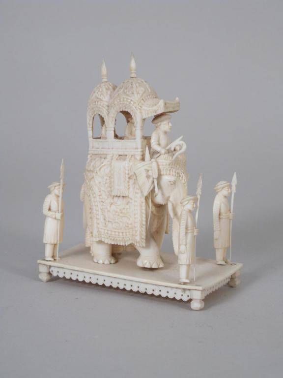 Appraisal: A carved ivory Elephant with howdah and figures on oblong