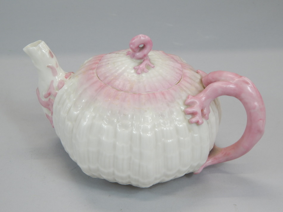 Appraisal: A Belleek porcelain urchin shaped teapot with a stylized pink