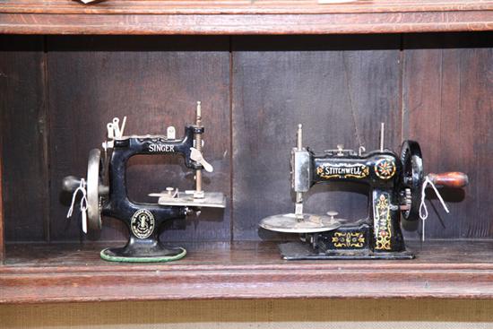 Appraisal: TWO CHILDRENS SEWING MACHINES Both black cast iron A ''Stitchwell''