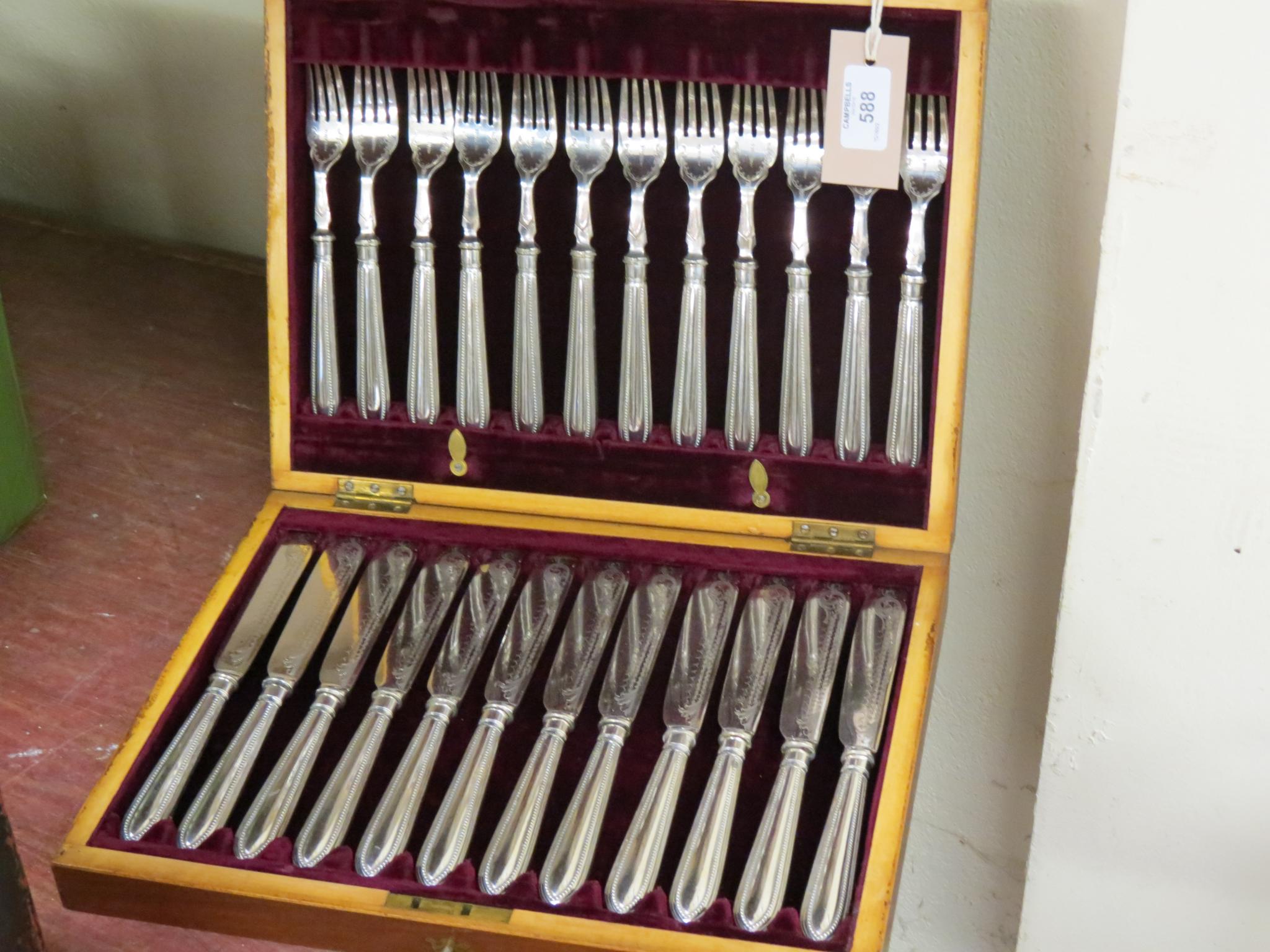 Appraisal: A set of twelve silver plated fish knives and forks