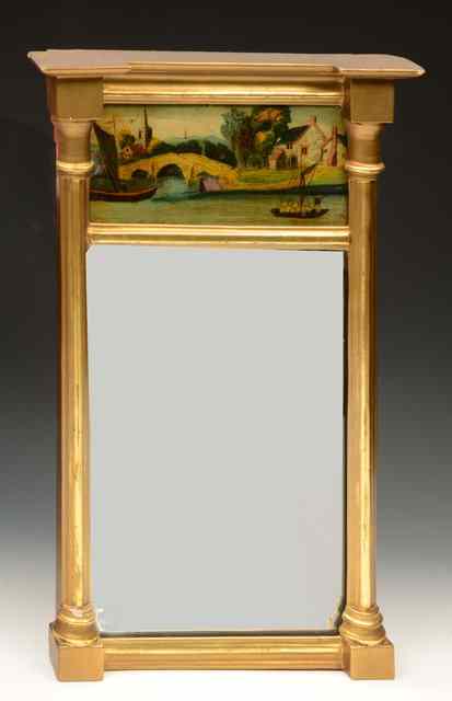 Appraisal: A REGENCY GILT WALL MIRROR with column supports and with