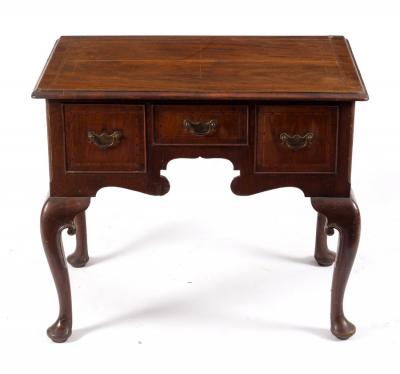 Appraisal: A George II walnut lowboy fitted three drawers to the