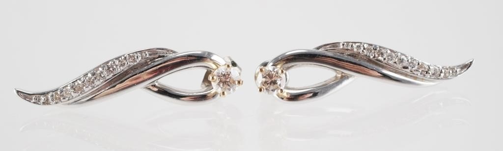 Appraisal: K yellow gold diamond studs mm in diameter with long