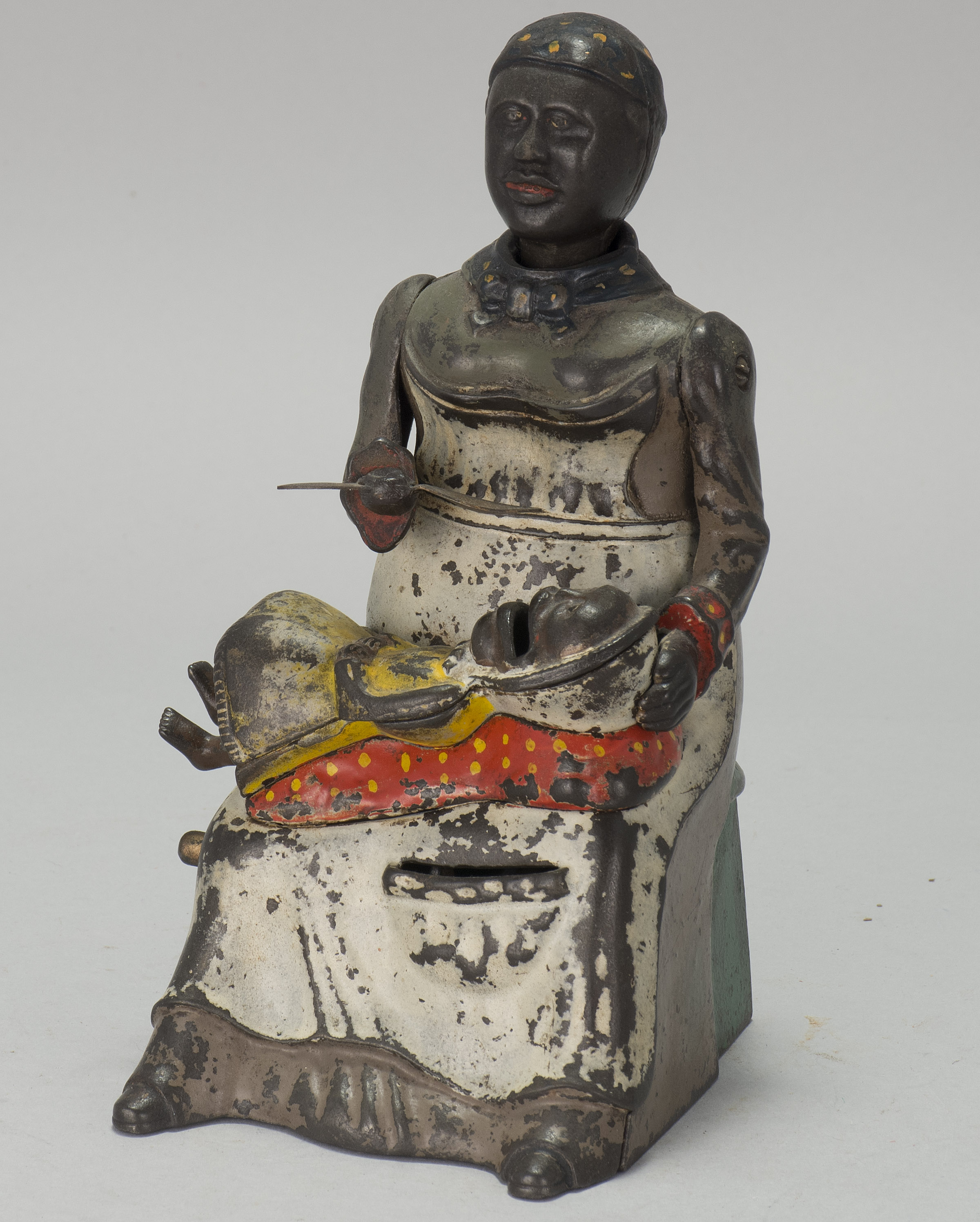 Appraisal: MAMMY AND CHILD CAST IRON MECHANICAL BANK Patented By Kyser