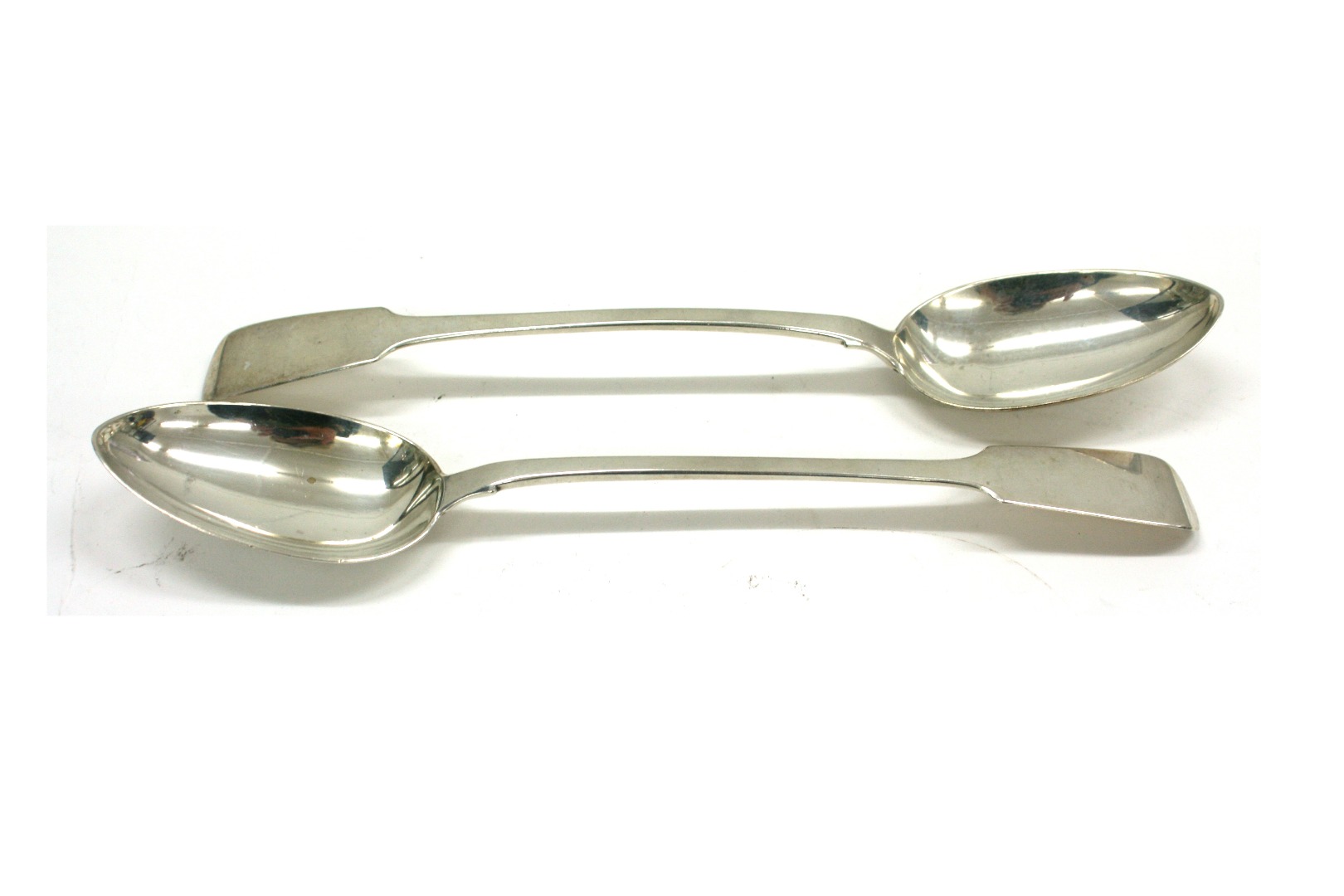 Appraisal: A pair of Victorian silver fiddle pattern basting spoons James