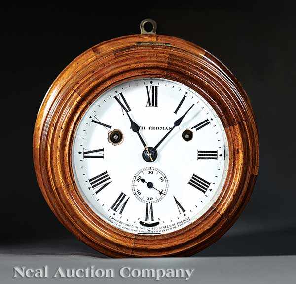 Appraisal: An Antique Seth Thomas Carved Walnut Ship's Clock early th