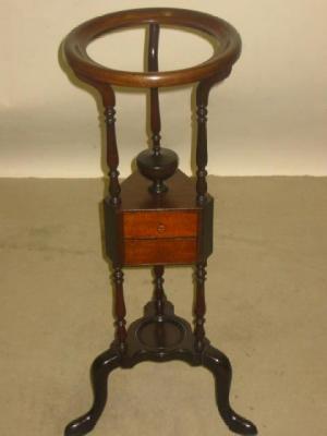 Appraisal: A MAHOGANY WASHSTAND of Georgian design the circular dish ring