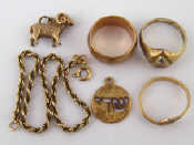 Appraisal: A mixed lot comprising two carat gold rings a charm