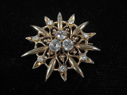 Appraisal: Sunburst brooch Yellow gold brooch set with seven petite old