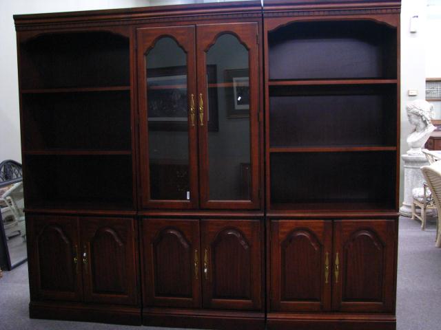 Appraisal: Three Piece Bookshelf Curio Unit raised panel doors and two