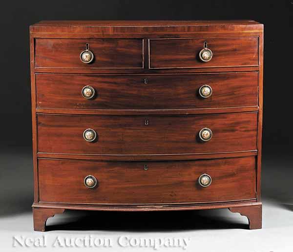 Appraisal: A Georgian Mahogany Bowfront Chest with two short drawers over