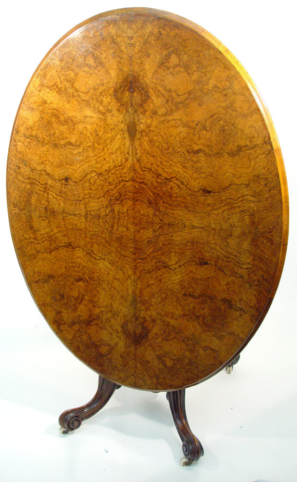 Appraisal: Victorian burr walnut oval tilt-top breakfast table supported by a