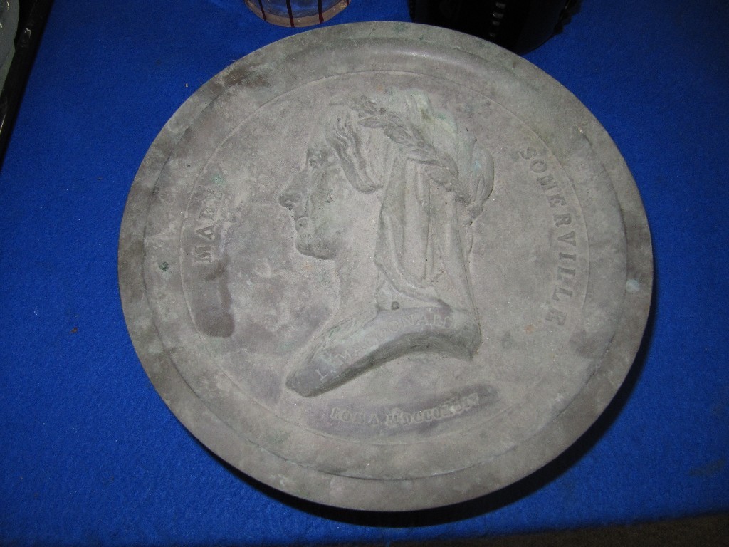 Appraisal: Circular wood and metal case containing a plaster relief of