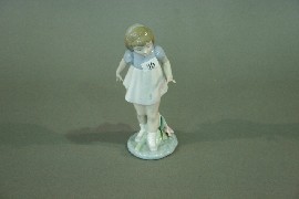 Appraisal: A Lladro figure of a girl with a flower