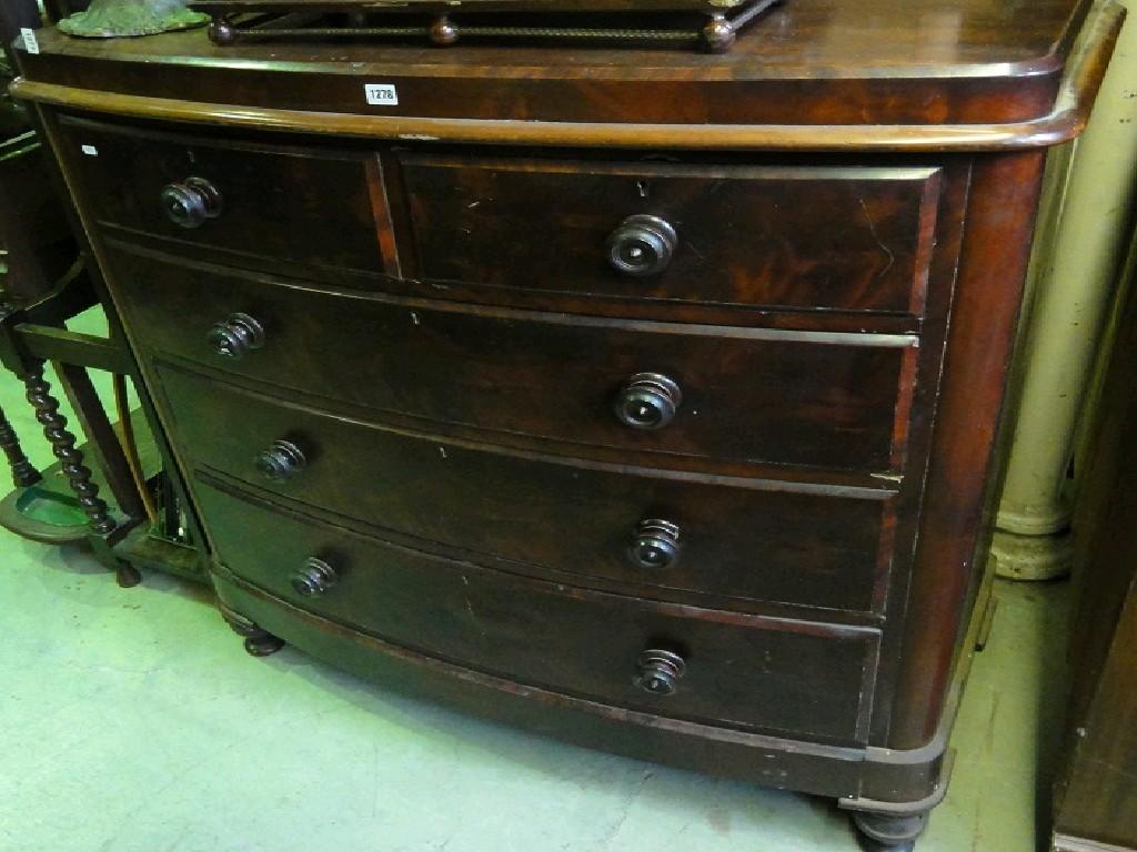 Appraisal: A Victorian mahogany bow fronted chest fitted with three long