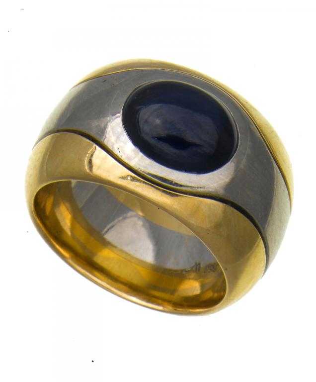 Appraisal: A STAR SAPPHIRE RING on substantial two colour gold band