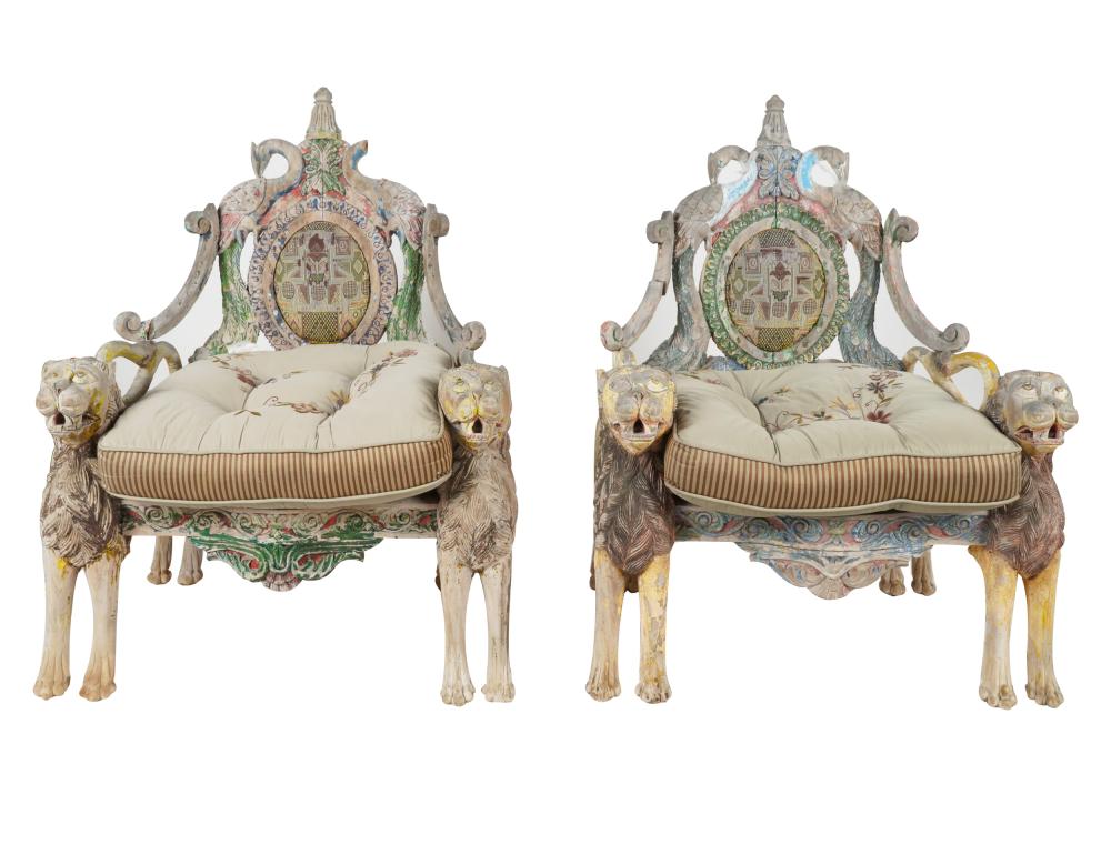 Appraisal: PAIR OF INDIAN CARVED PAINTED WOOD ARMCHAIRScarved with lions and