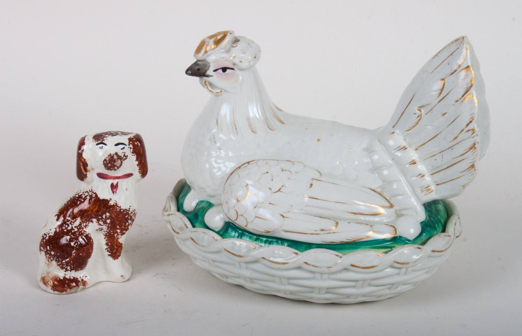 Appraisal: Staffordshire earthenware hen on nest spaniel late th century modeled