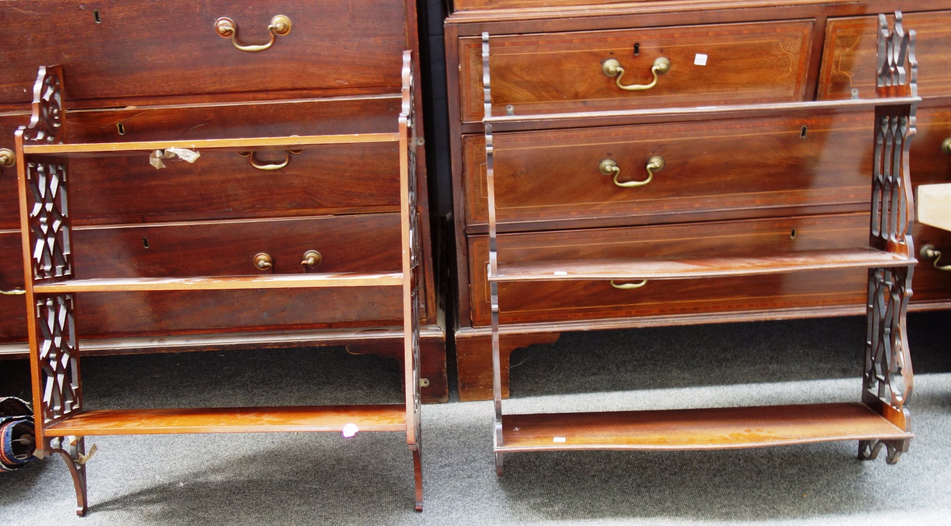 Appraisal: A th century mahogany serpentine three tier hanging wall shelf