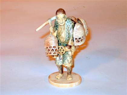 Appraisal: Japanese carved ivory figure of a basket seller late th