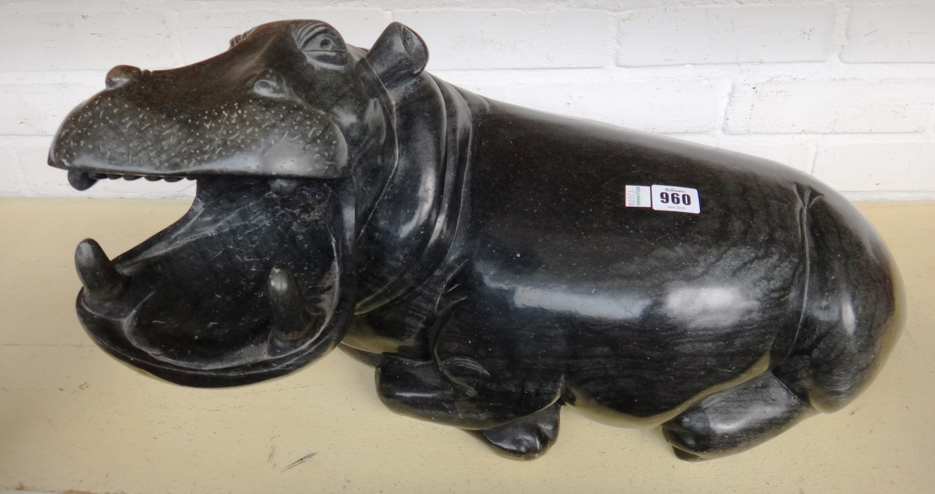 Appraisal: An African polished hardstone carved hippopotamus late th century modelled