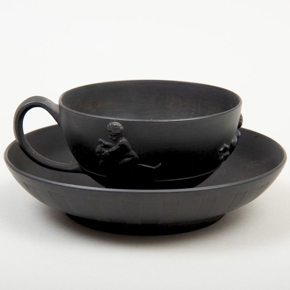 Appraisal: Wedgwood Black Basalt Cup and Saucer Impressed lowercase mark decorated