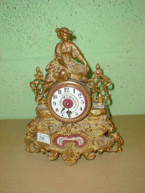 Appraisal: A thC French gilt metal mantel clock with figure