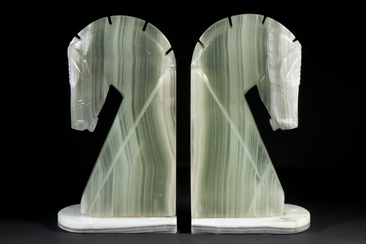 Appraisal: PR ONYX HORSE HEAD BOOKENDS Pale Green and White Striated