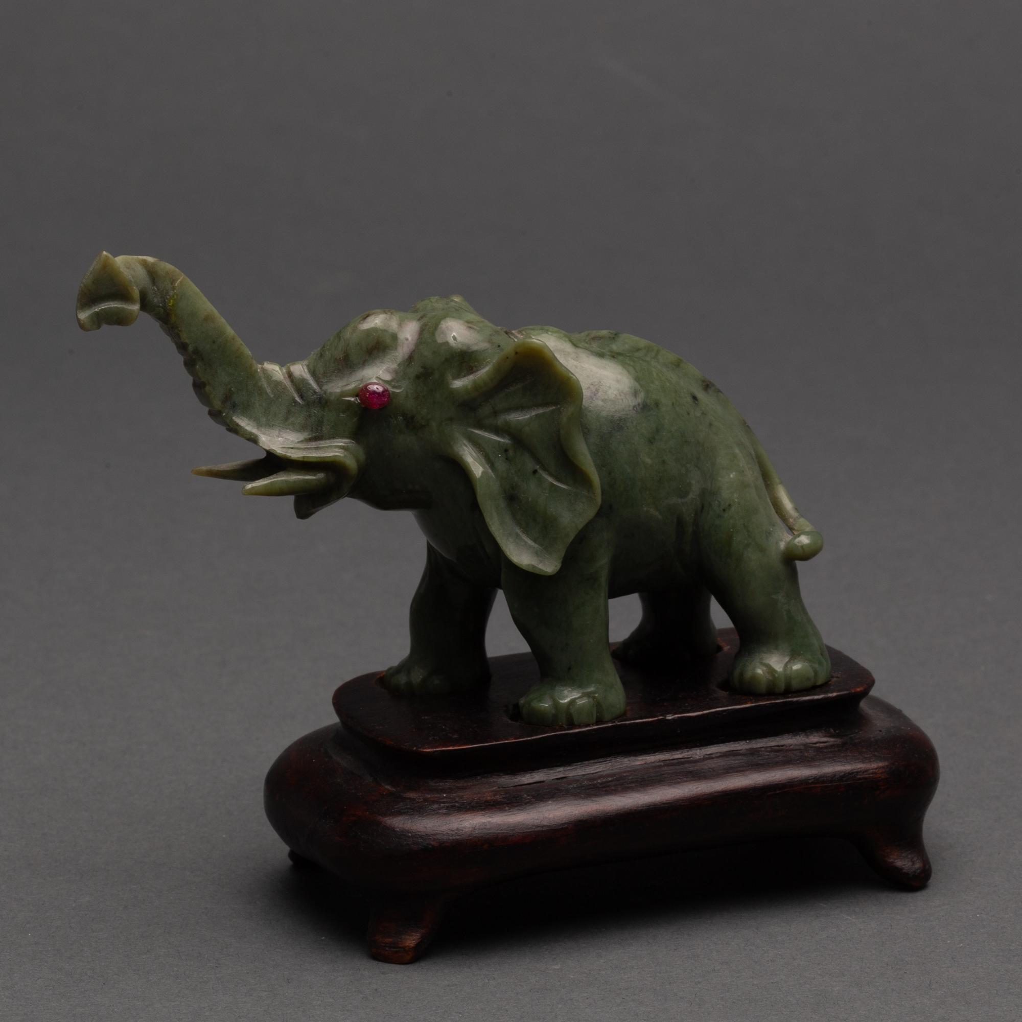 Appraisal: CARVED CHINESE SPINACH NEPHRITE JADE ELEPHANT WITH RUBY EYES TH