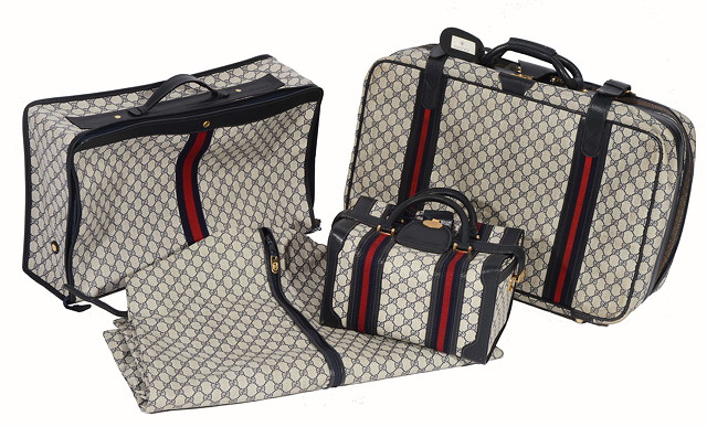 Appraisal: A 'GUCCI' LUGGAGE SET comprising of two suitcases a train