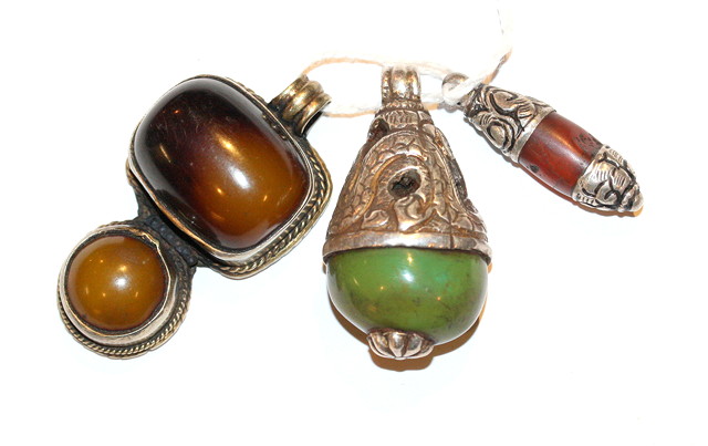 Appraisal: A MIDDLE EASTERN GREEN HARDSTONE AND WHITE METAL PEAR SHAPED