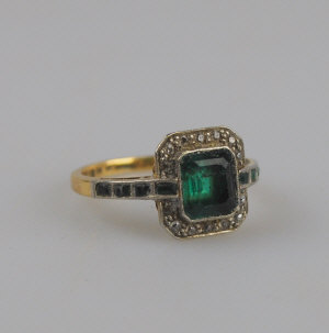 Appraisal: Art Deco emerald and diamond cluster ring the centre rectangular