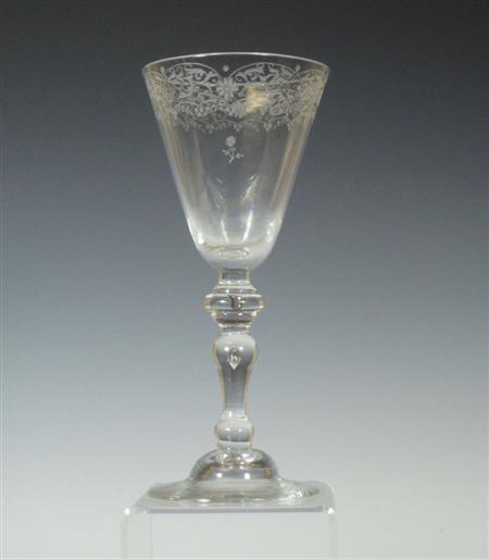 Appraisal: A tall late th century trumpet bowl wine glass with