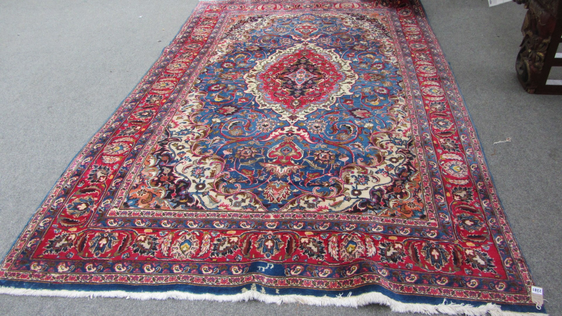 Appraisal: A Tabriz carpet Persian the indigo field with a madder