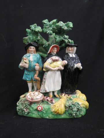 Appraisal: Staffordshire Pottery Figurine farm family with preacher th century