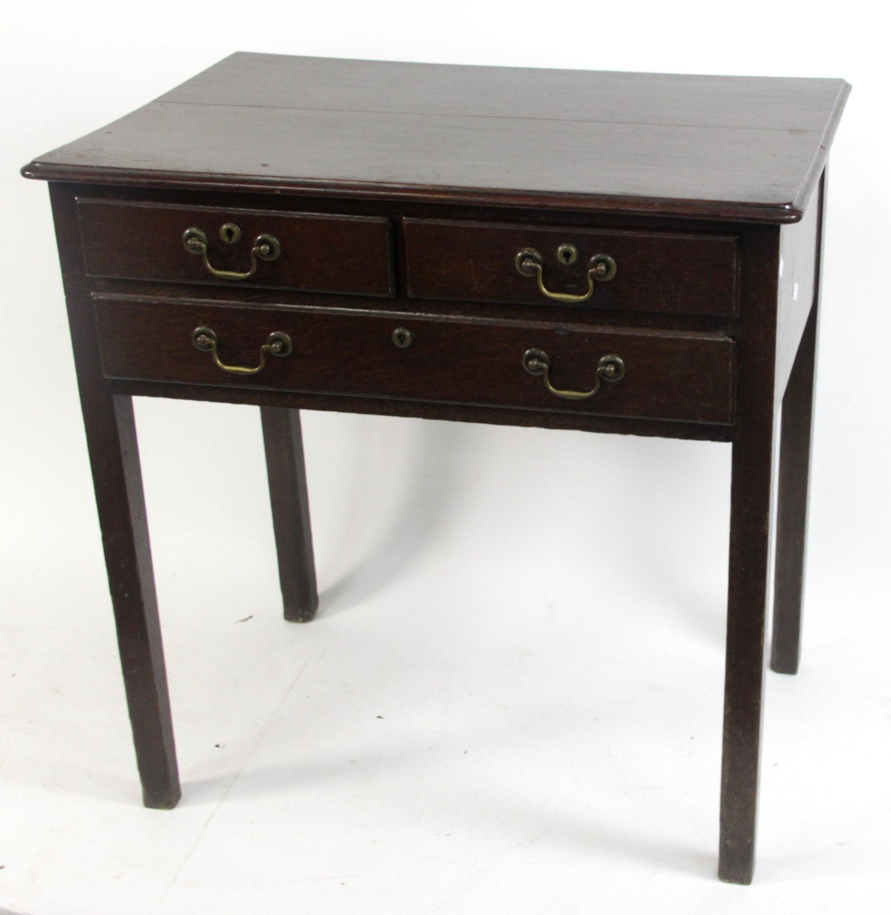 Appraisal: An th Century oak three-drawer side table on square legs