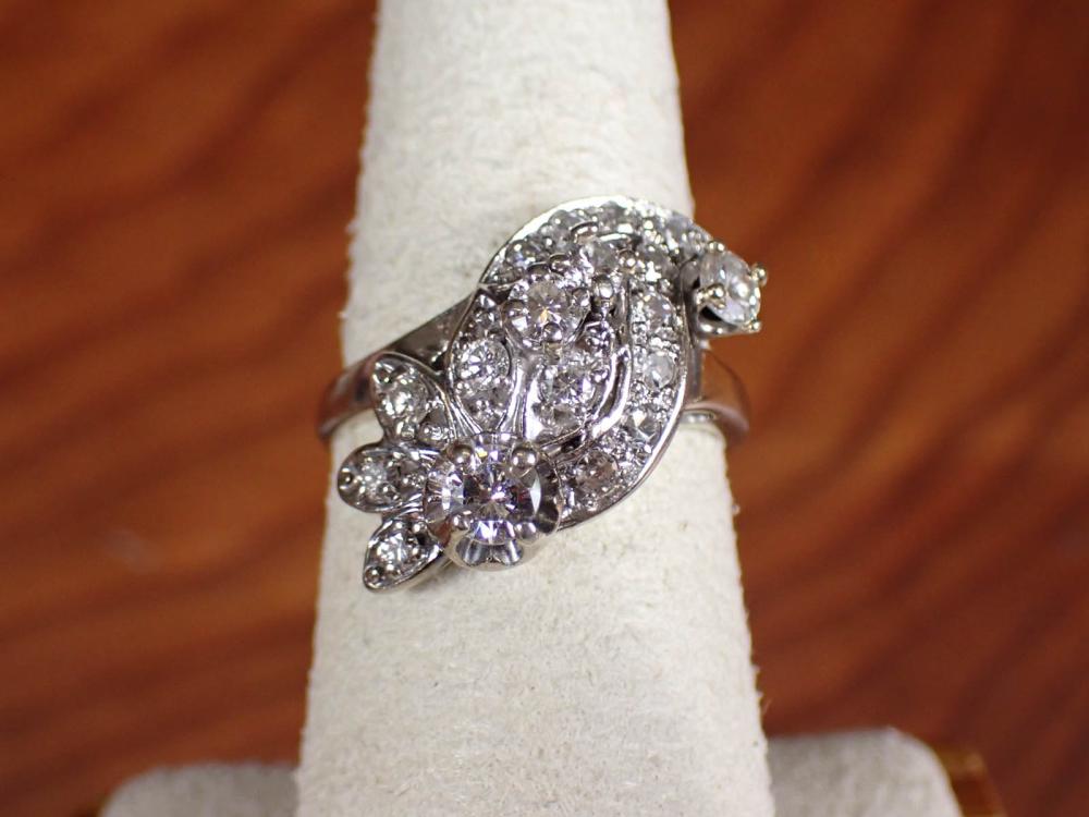 Appraisal: ESTATE DIAMOND AND FOURTEEN KARAT GOLD RING The white gold