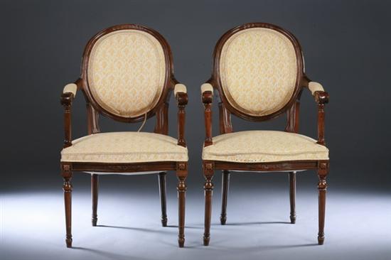 Appraisal: PAIR LOUIS XVI STYLE PROVINCIAL FRUITWOOD FAUTEUILS th century with