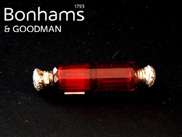 Appraisal: A Victorian double ended scent bottle in facetted ruby glass