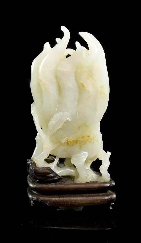 Appraisal: A Chinese Jade Buddha Hand of pale celadon with areas