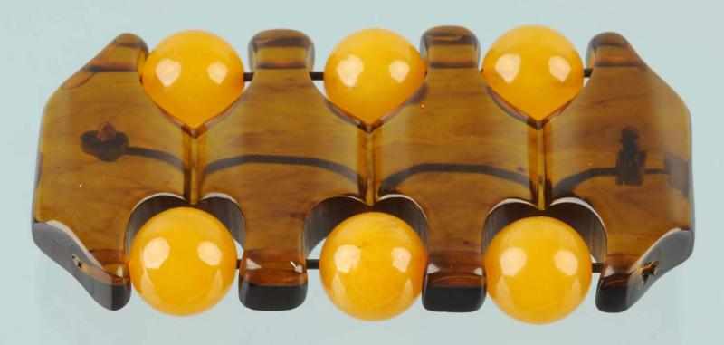 Appraisal: Bakelite Geometric Pin with Butterscotch Balls Condition Excellent Size L