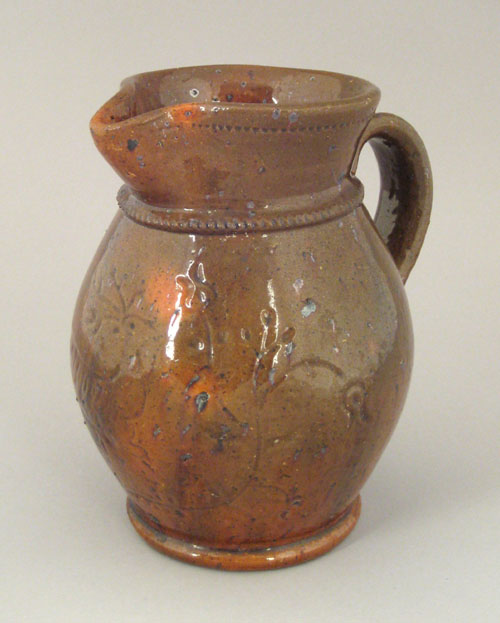 Appraisal: Medinger redware pitcher with incised stag decoration h