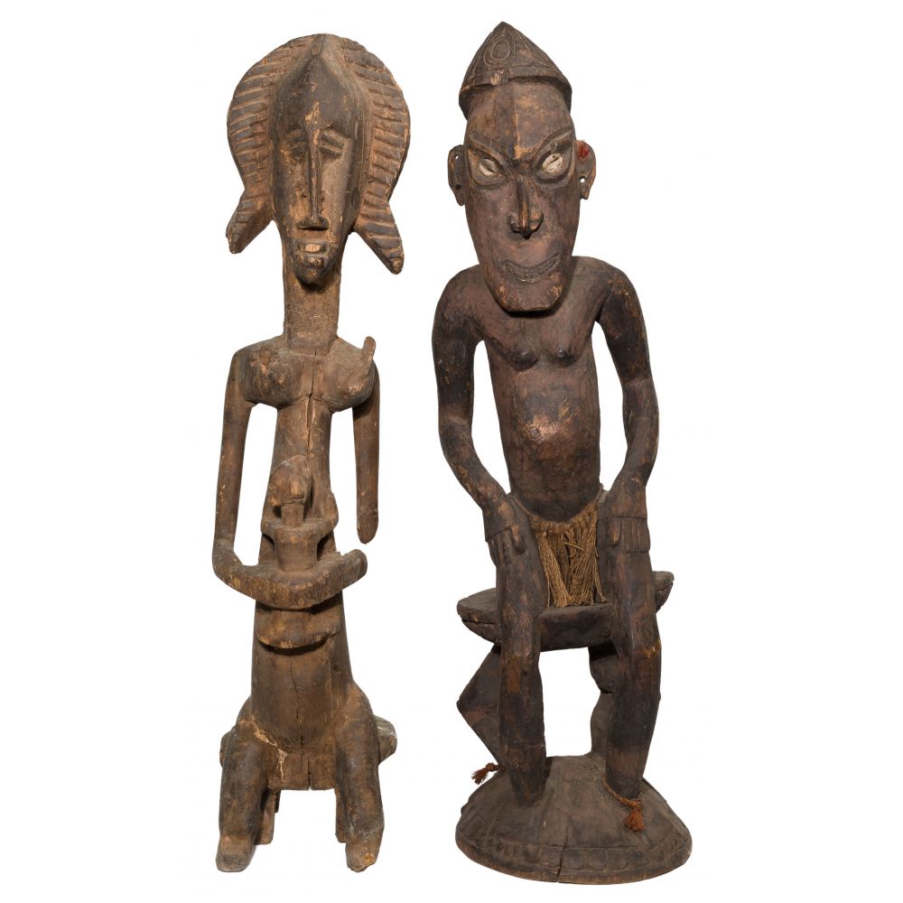 Appraisal: ETHNOGRAPHIC CARVED WOOD FIGURES figure depicting a male and a