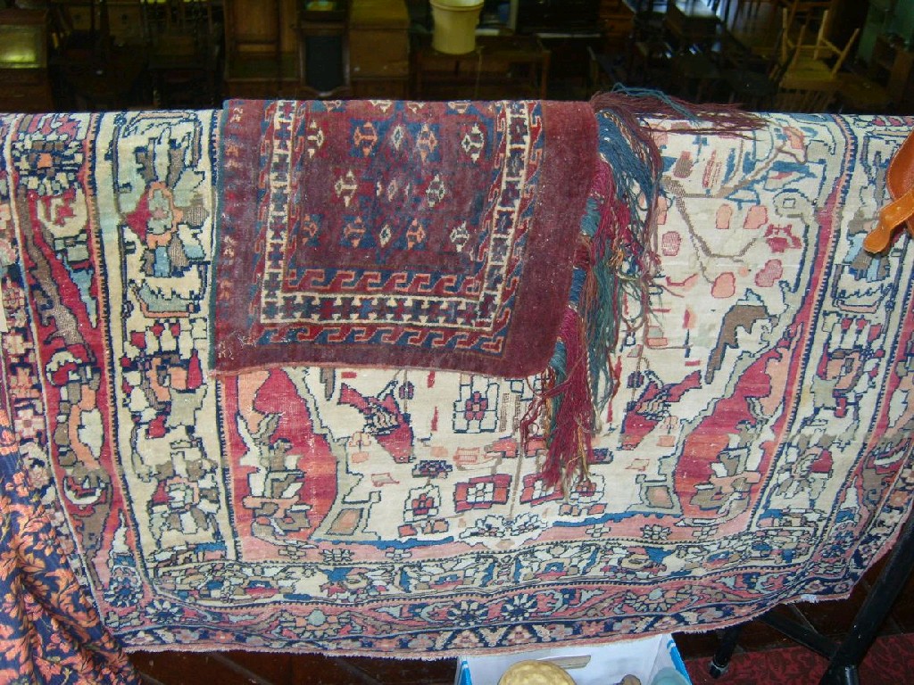 Appraisal: A Persian rug ' x ' approx together with a