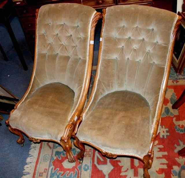 Appraisal: A PAIR OF VICTORIAN WALNUT FRAME OCCASIONAL CHAIRS with scroll