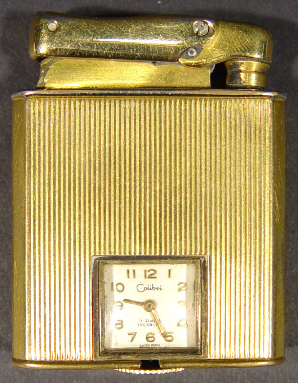 Appraisal: Colibri Monopol gold plated lighter set with a jewelled Swiss