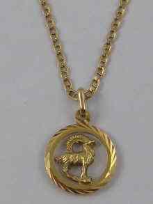 Appraisal: A yellow metal tests ct gold Aries zodiac sign on