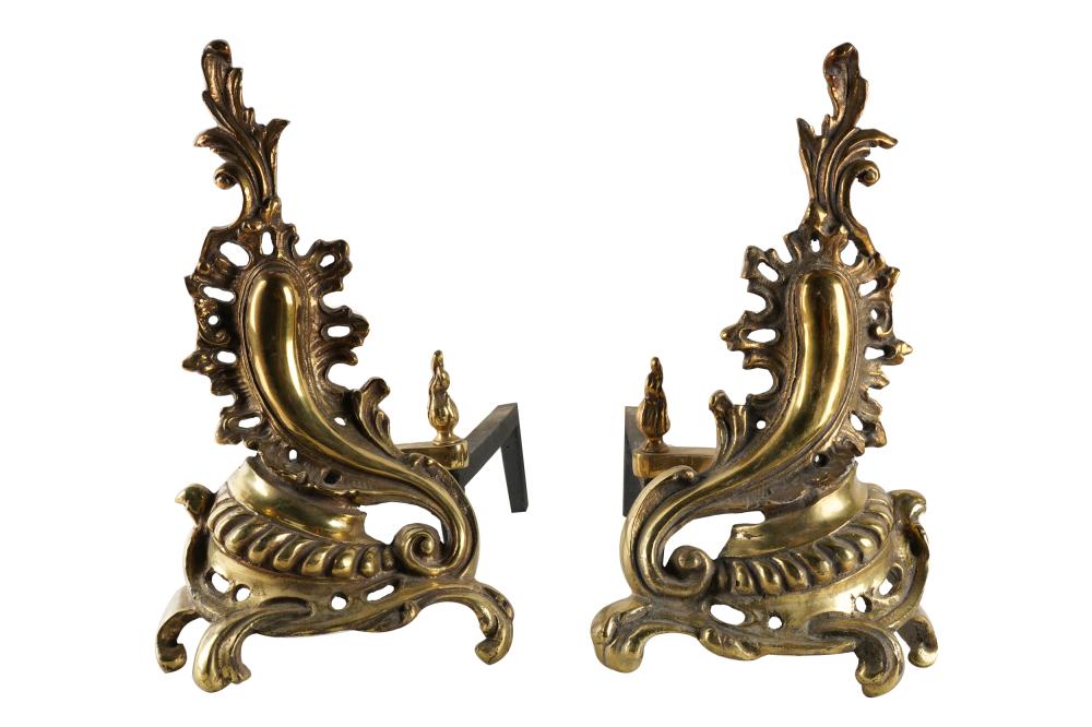 Appraisal: PAIR OF ROCOCO STYLE GILT BRASS CHENETSwith iron billet bars